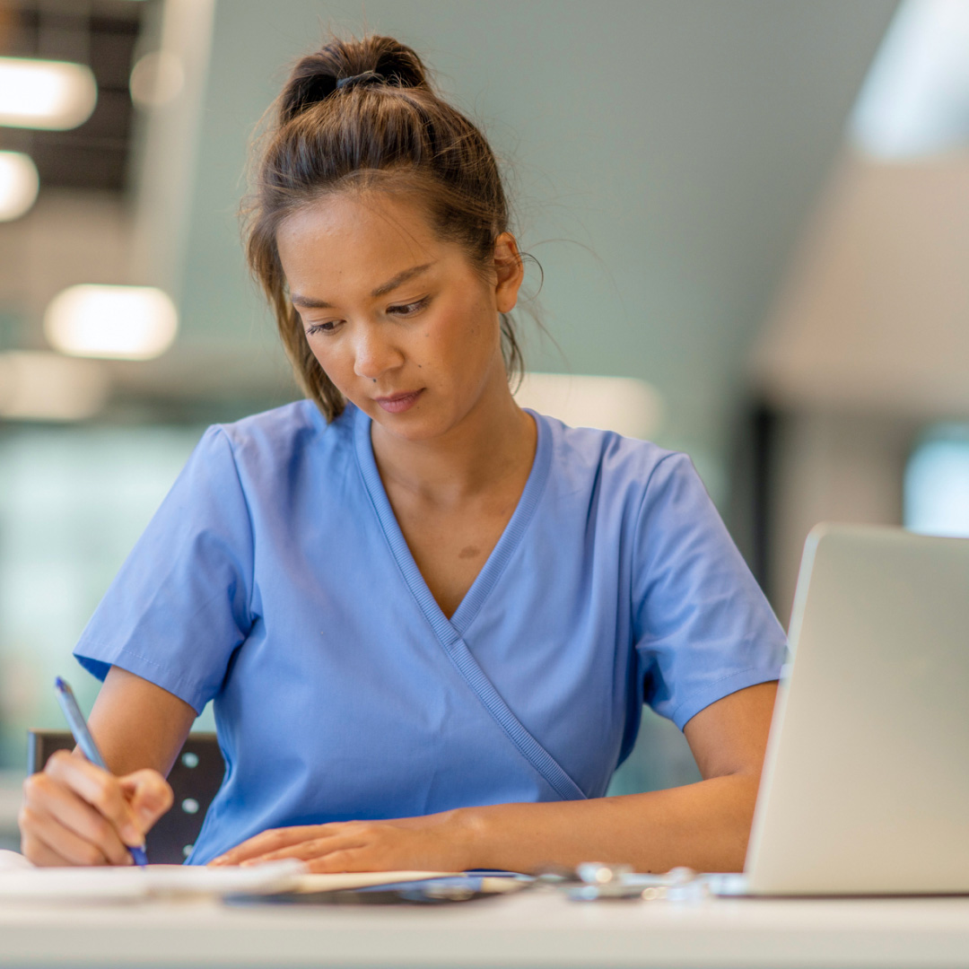 A nurse writing.